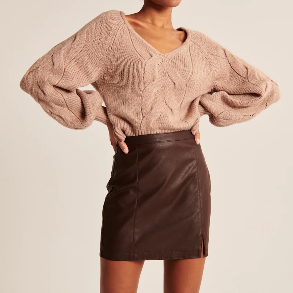Brown leather mini skirt. New with tags. Vegan leather. Fully lined.